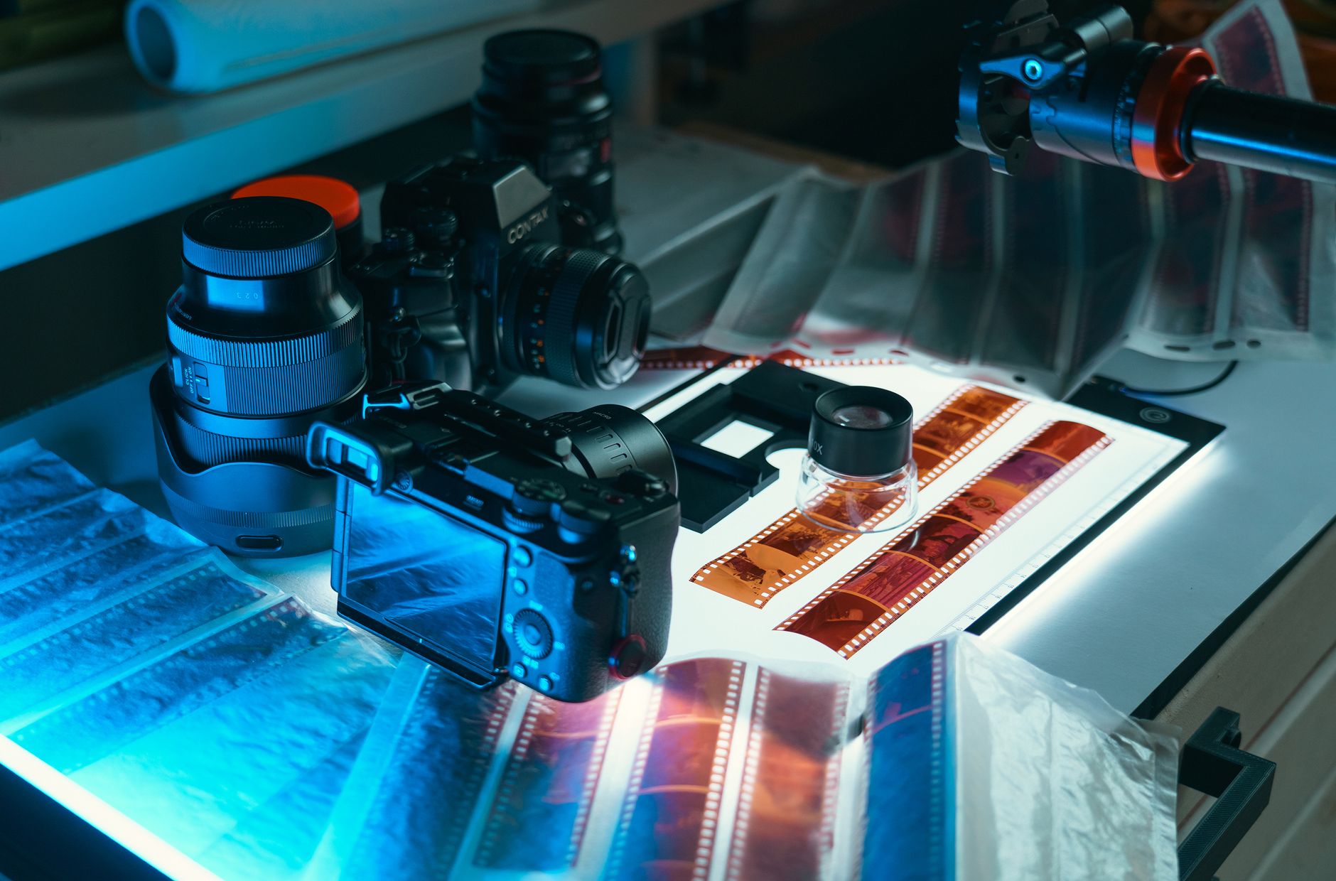 A comprehensive setup for digitizing analog film negatives to digital format in a photography studio.
